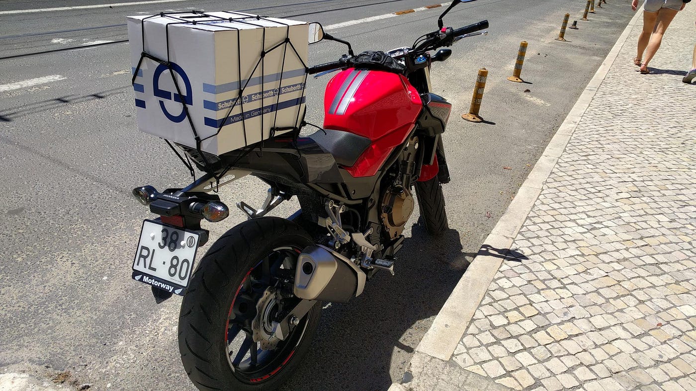 Groceries strapped to a motorbike